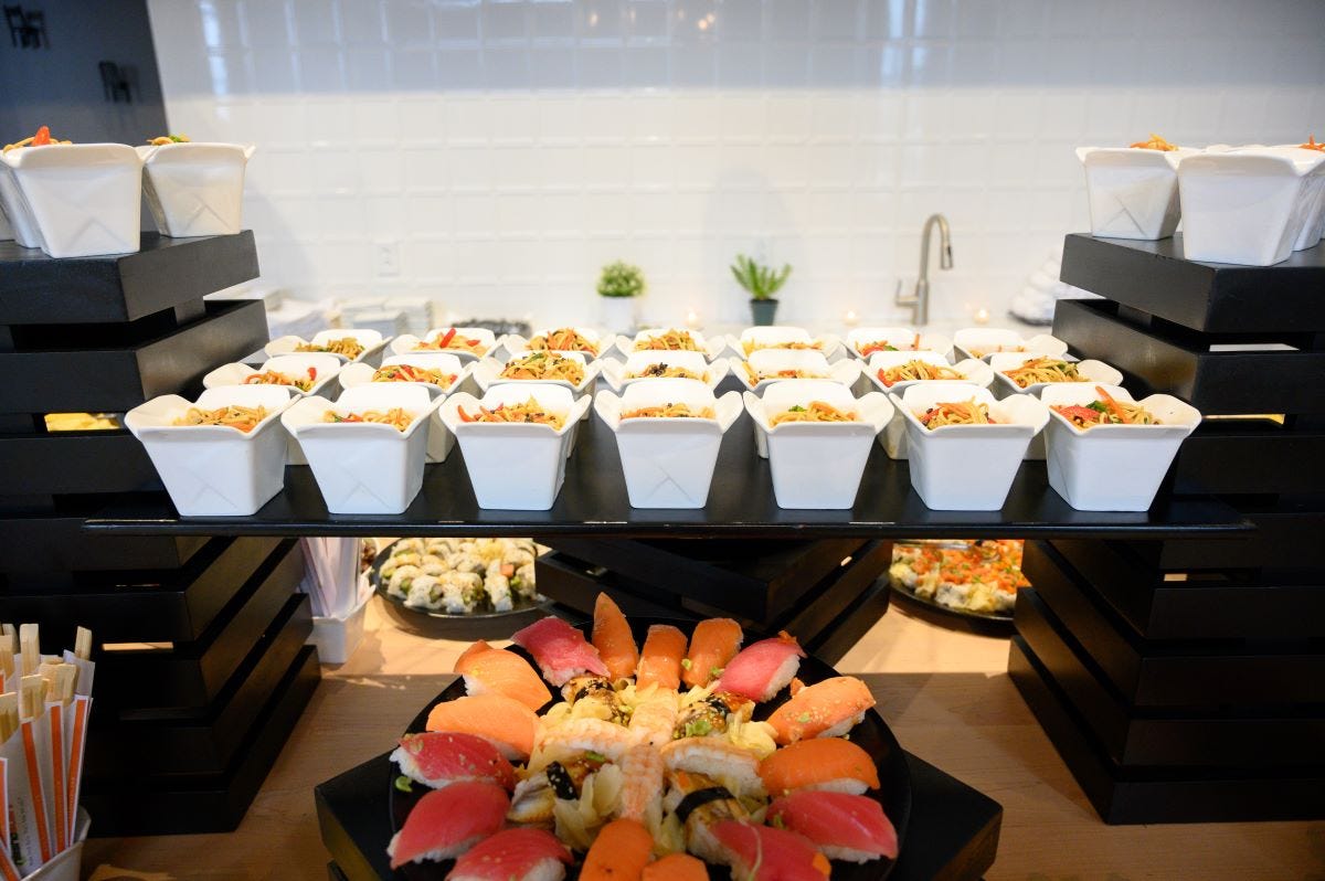 Bamboo display towers showcasing sushi