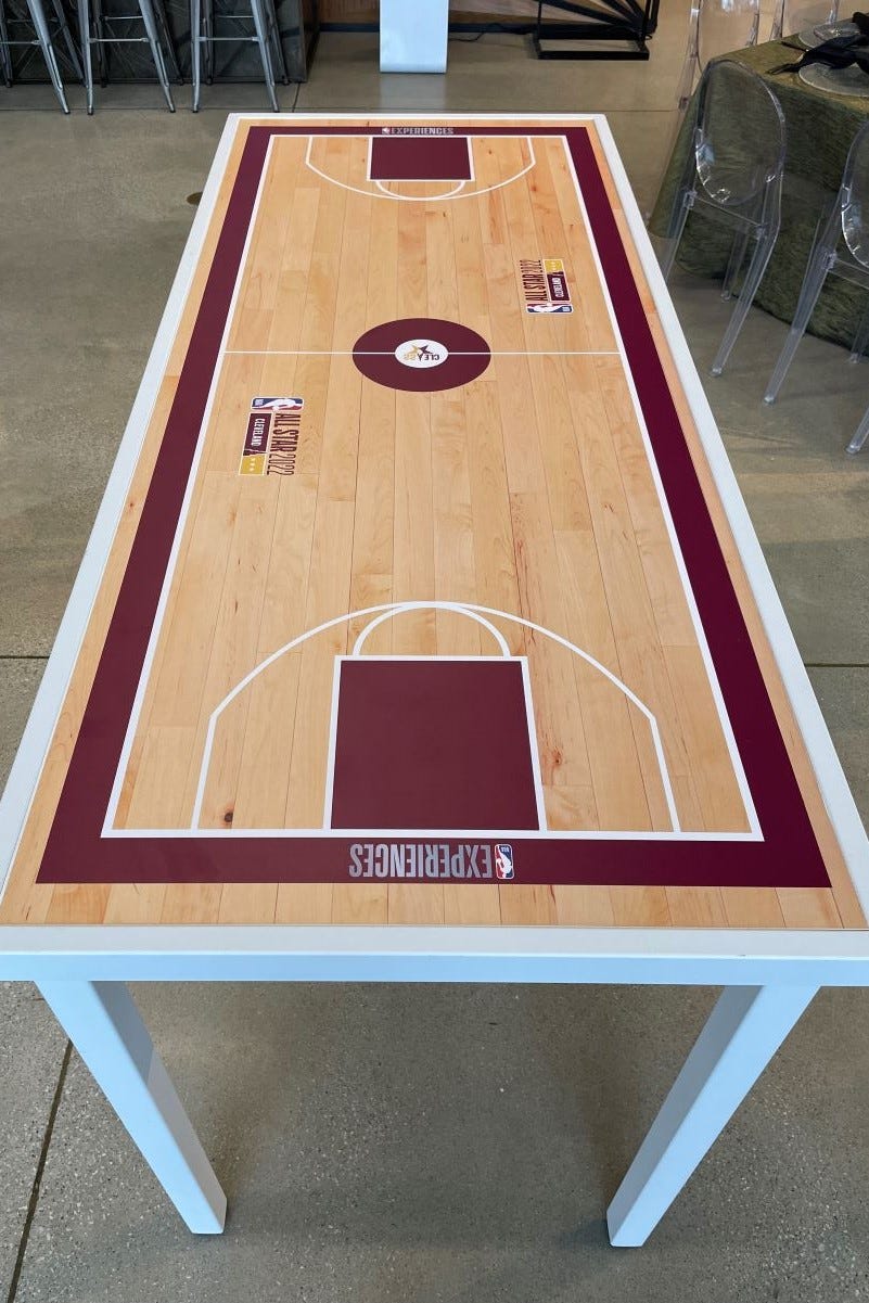 Bianco Table with logos and graphics to make the tabletop look like a basketball court